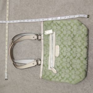 Coach green signature used and shows signs of wear